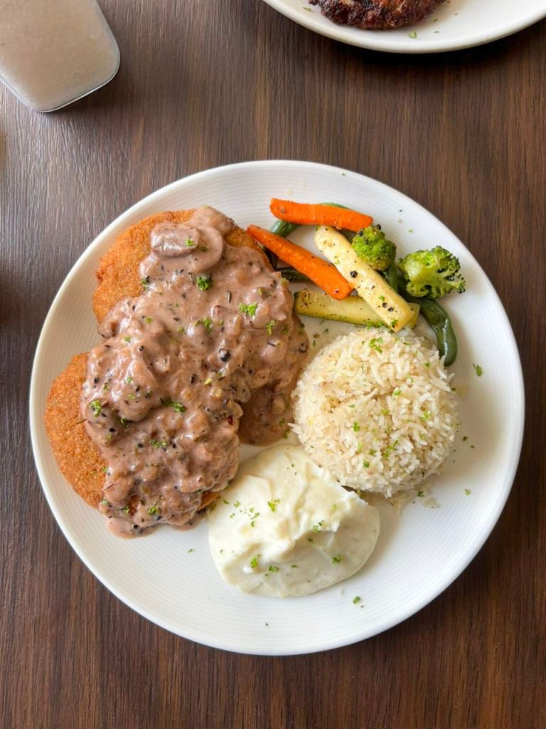 Gourmet vegetarian steak with rice and vegetables