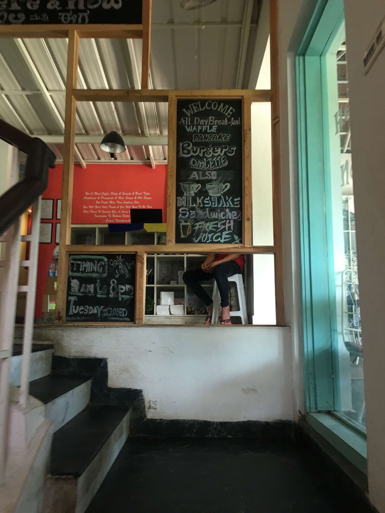 The chalkboard menu near the stairwell